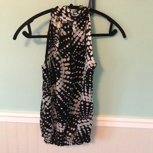 Black and white sleeveless blouse